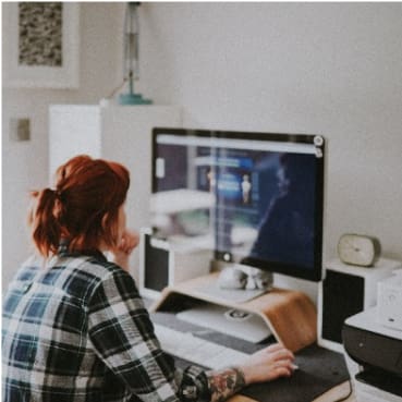 person looking at a screen with a website open