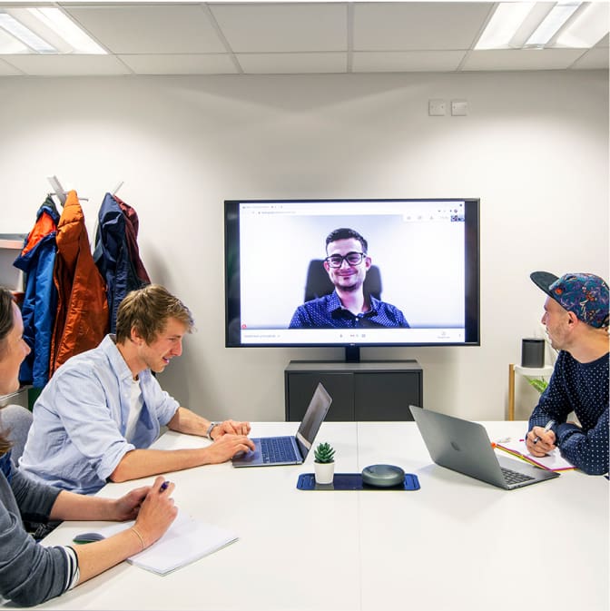 Hiyield team sat around desk on a google meet